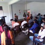 Public from nearby towns and villages listening to the address